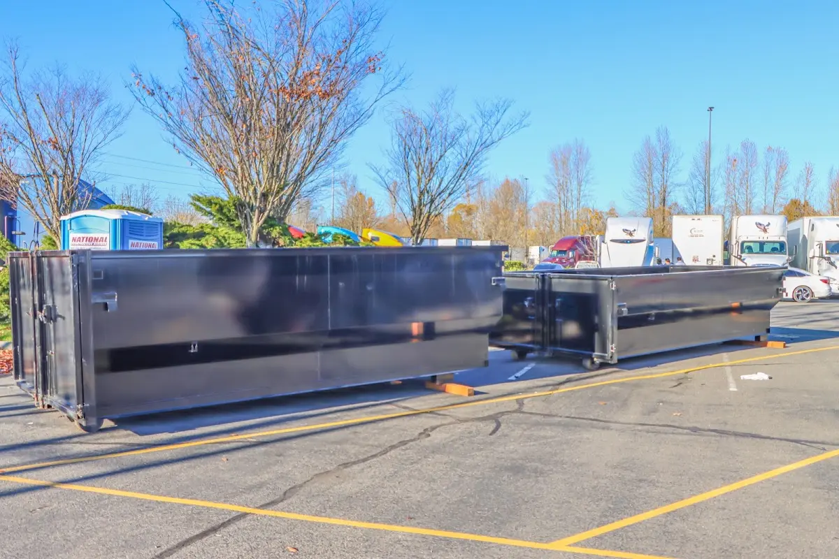 Professional dumpster rental service with roll-off container on residential driveway in Somers